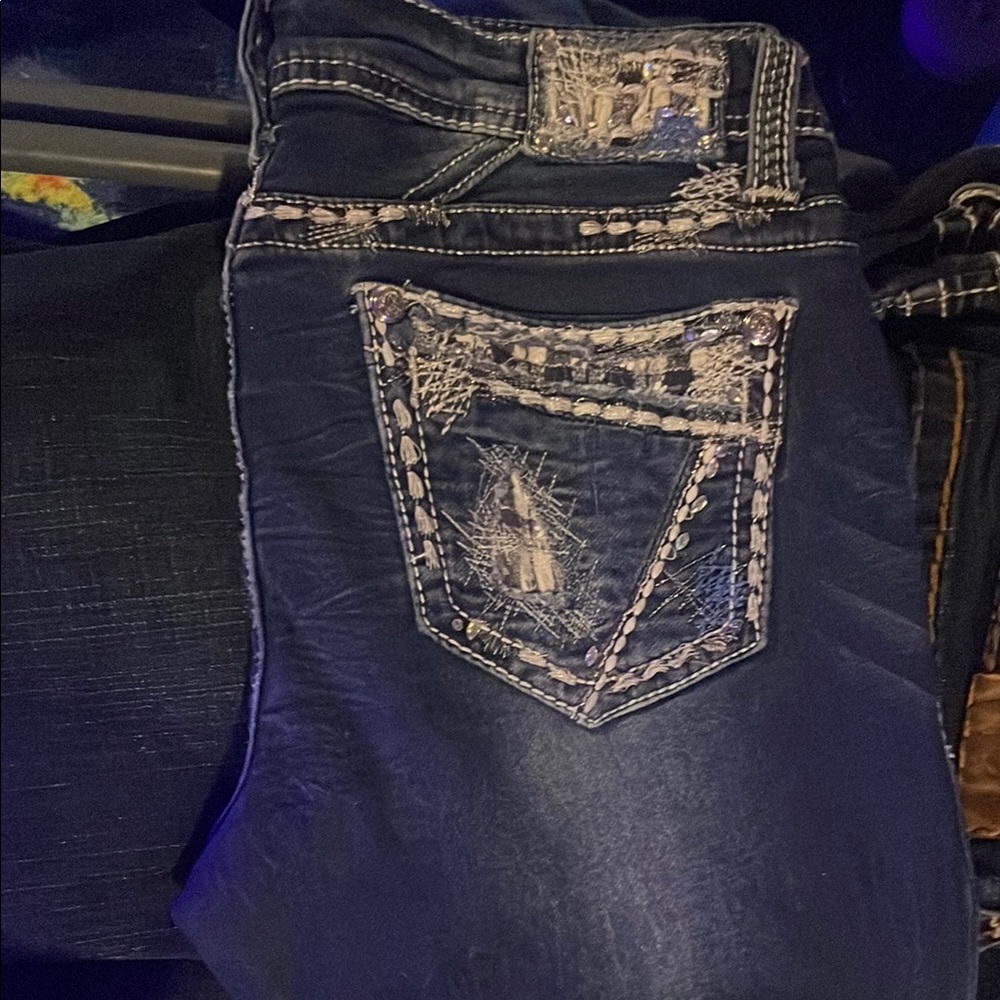 Grace in LA Blue Jeans with Distinctive Stitching